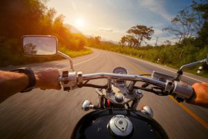 Close up from a motorcyclist’s perspective riding on a sunny spring day