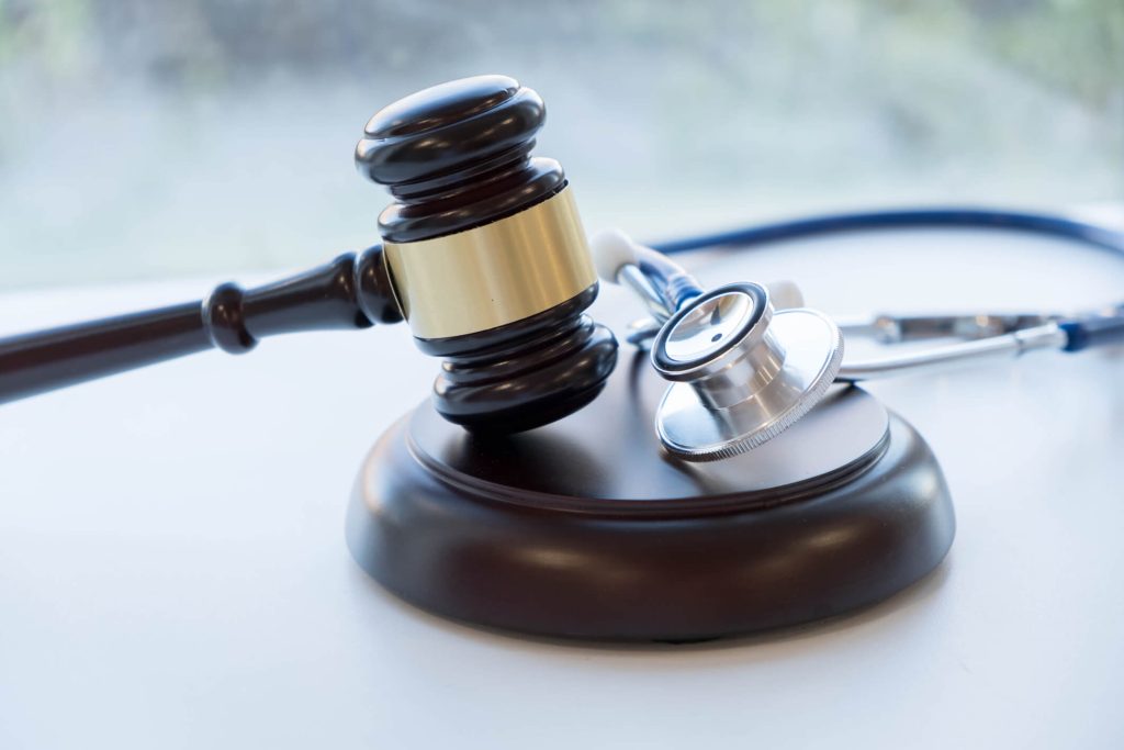 Close-up of a gavel and stethoscope