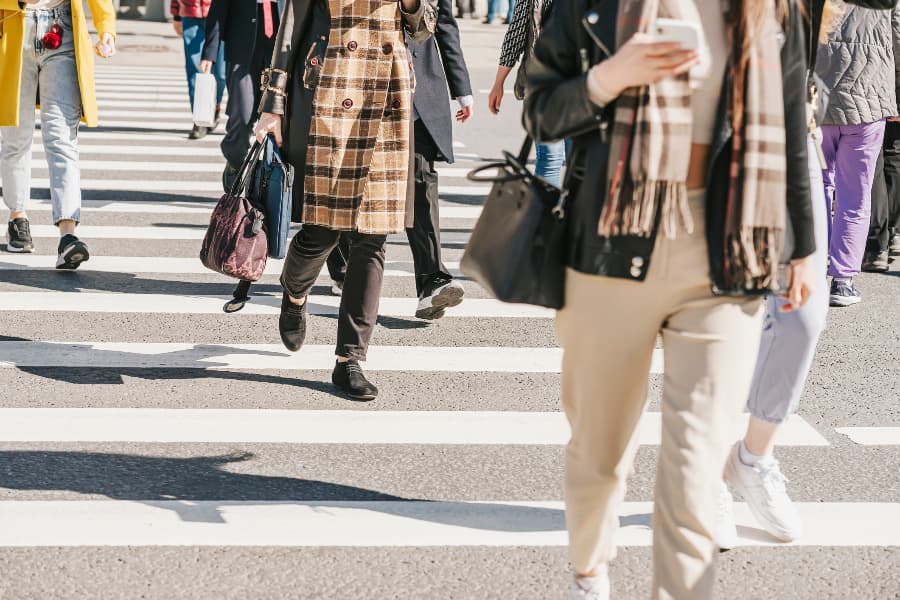 Blurred image of people in a crosswalk